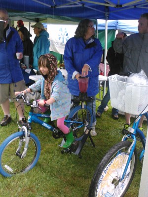 bike powered blender a girl pedals a bicycle hooked up to a blender