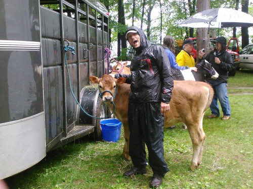 soaked dan with cow Dan poses with a heifer in the rain
